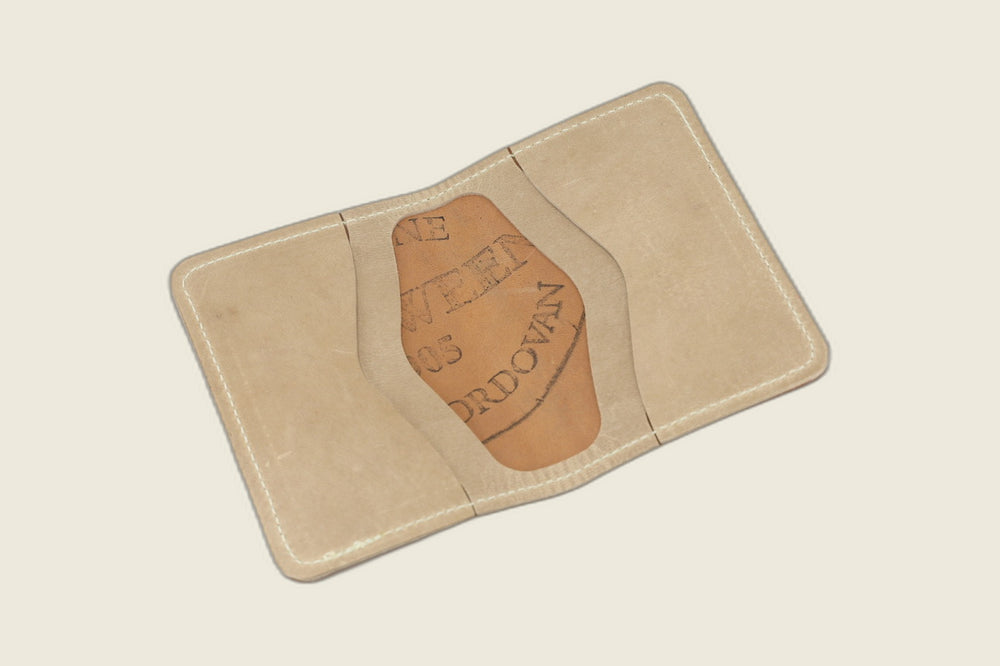 Warden bifold opened to natural Cypress horsehide card pockets, Horween cordovan stamp in the well
