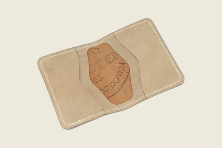 Warden bifold opened to natural Cypress horsehide card pockets, Horween cordovan stamp in the well