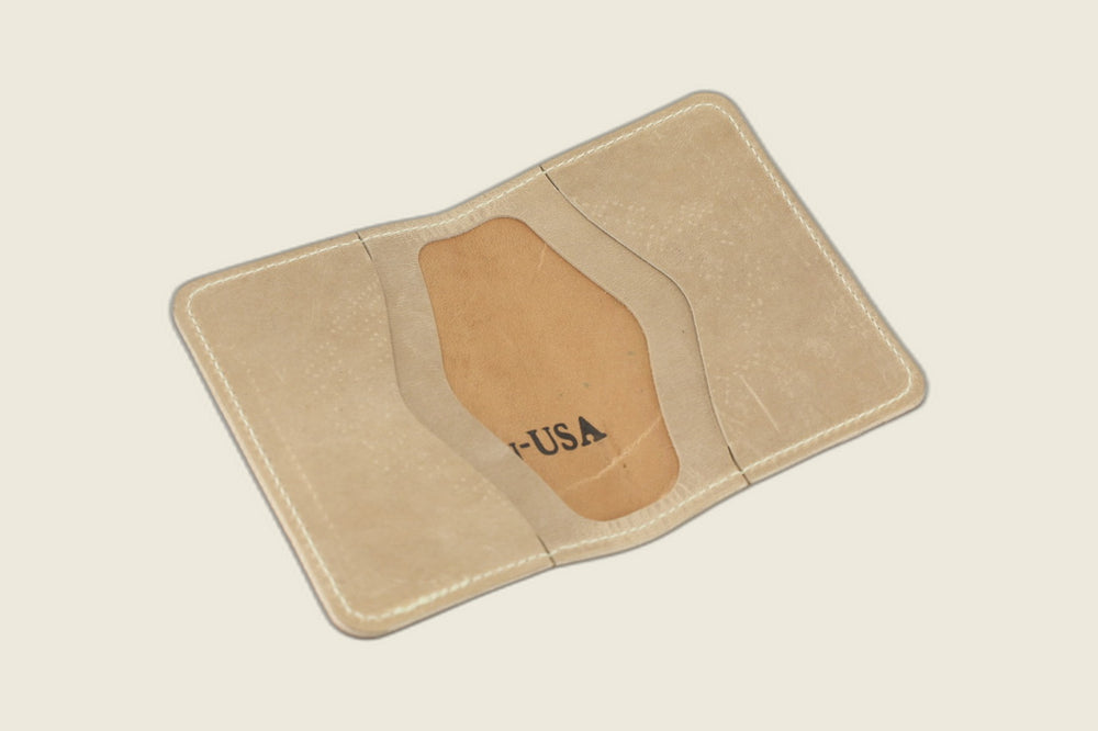 Warden bifold opened to natural Cypress horsehide card pockets with USA stamp in the well