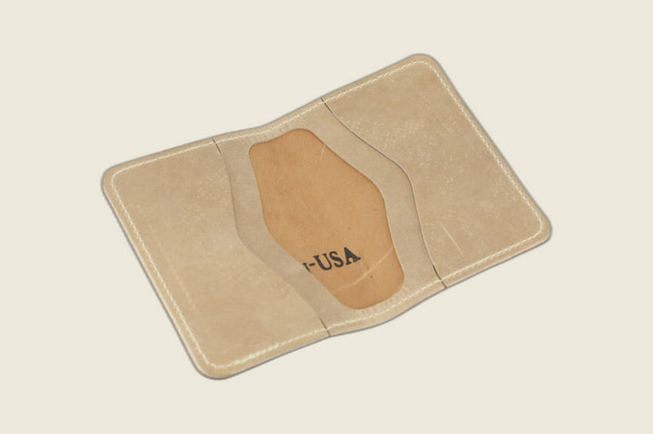 Warden bifold opened to natural Cypress horsehide card pockets with USA stamp in the well