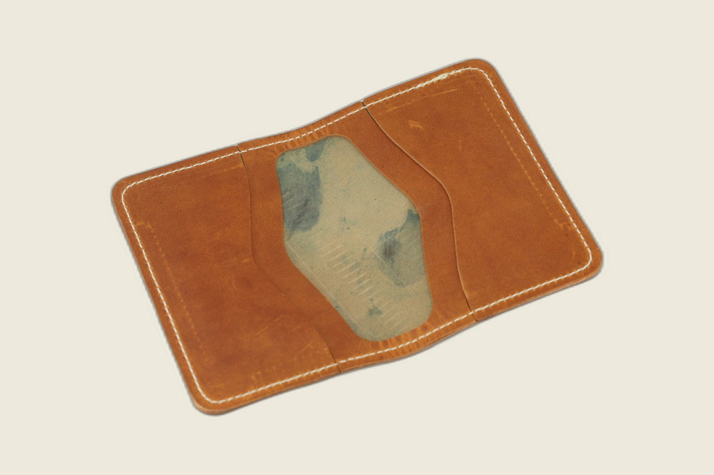 Warden bifold interior in English tan Cypress horsehide, card pockets with blue-green tannery stamp