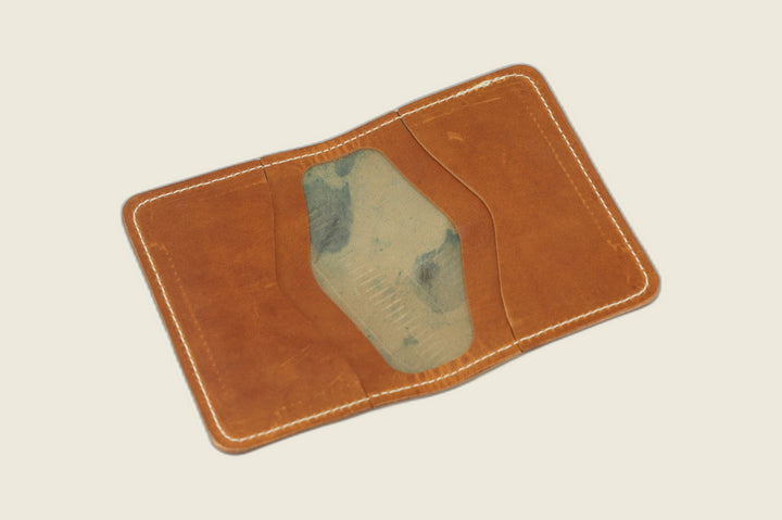 Warden bifold interior in English tan Cypress horsehide, card pockets with blue-green tannery stamp