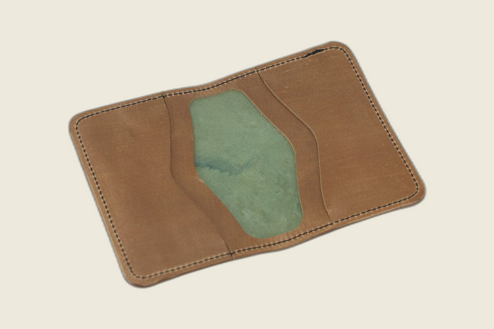 Warden bifold interior with natural Chromexcel horsehide card pockets around a sage-green well