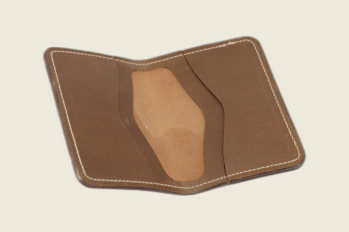 Warden wallet opened to its olive-toned natural Chromexcel horsehide interior with card recesses