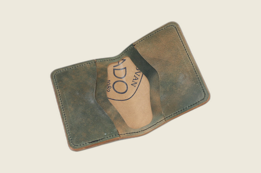 Warden bifold interior with olive-green Rocado card pockets and Rocado-stamped tan well
