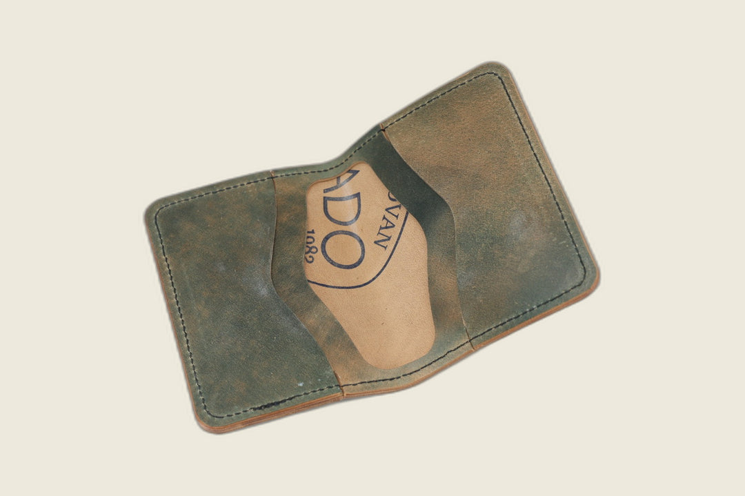 Warden bifold interior with olive-green Rocado card pockets and Rocado-stamped tan well