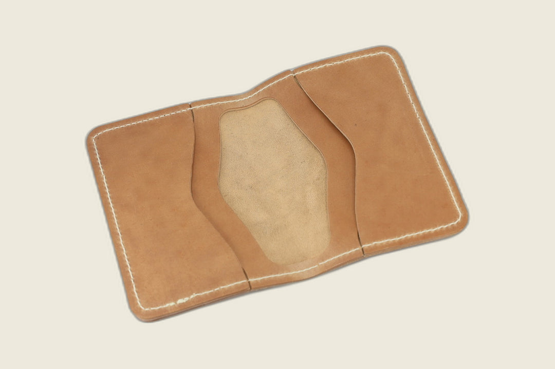 Warden bifold interior with natural Cloe shell card pockets and soft suede well