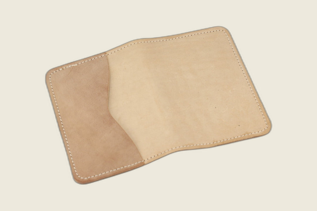 Warden bifold wallet in unglazed natural Cloe shell cordovan, cream-beige exterior, studio flat lay
