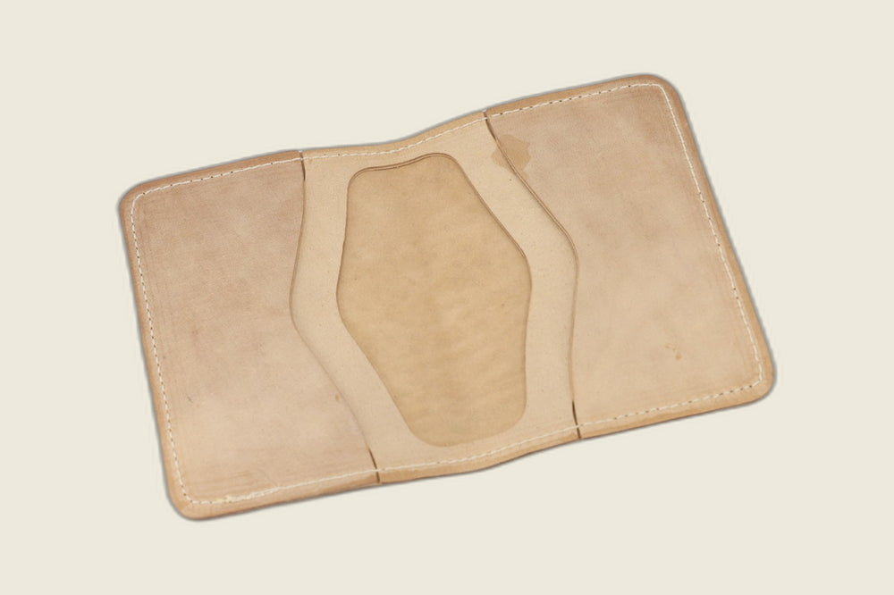 Warden bifold interior with pale unglazed Cloe shell card pockets and faintly stamped well