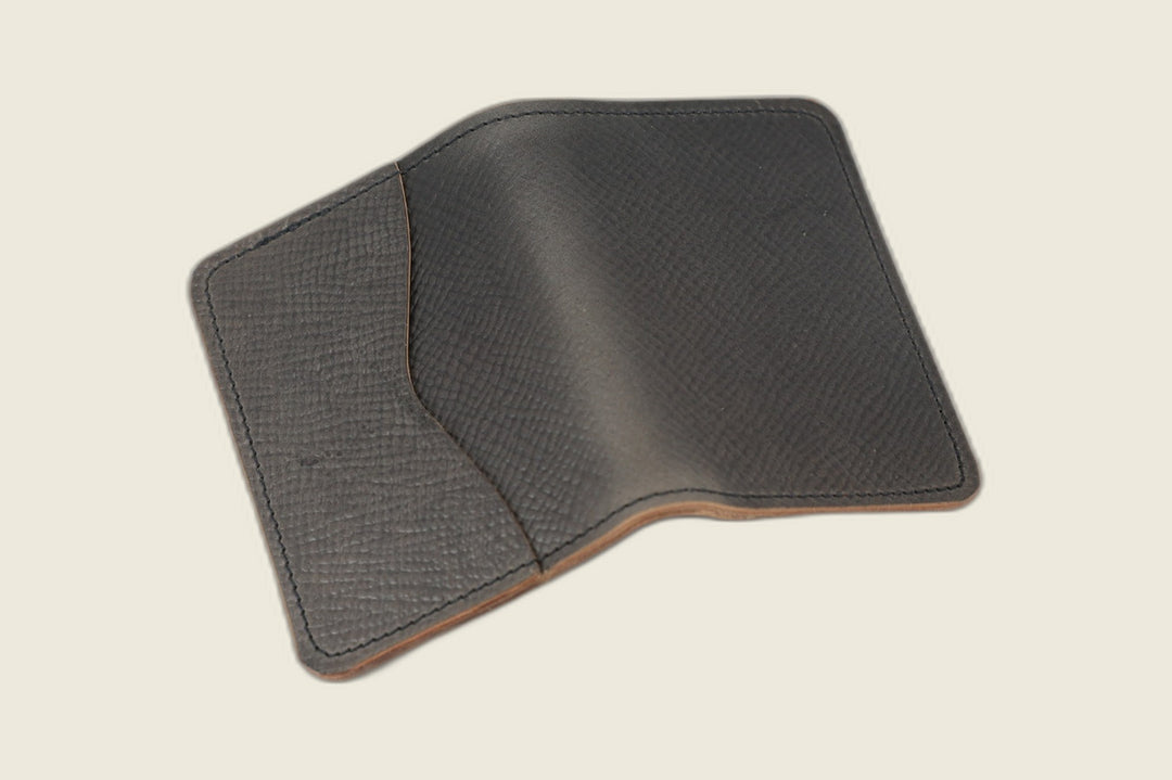 Warden bifold wallet in gray Russian grain Toscana Italia shell cordovan, pebbled exterior, cream flat lay