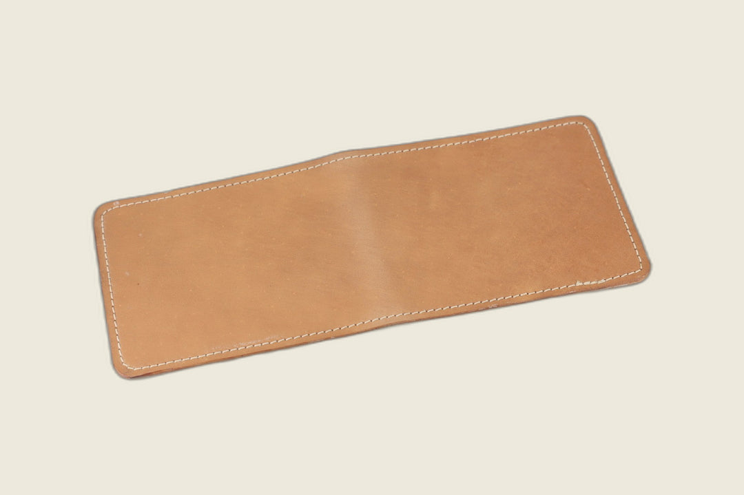 Stronghold bifold wallet in natural glazed shell cordovan, warm tan tone, open flat exterior view