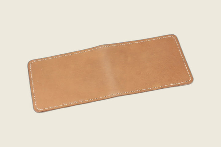 Stronghold bifold wallet in natural glazed shell cordovan, warm tan tone, open flat exterior view