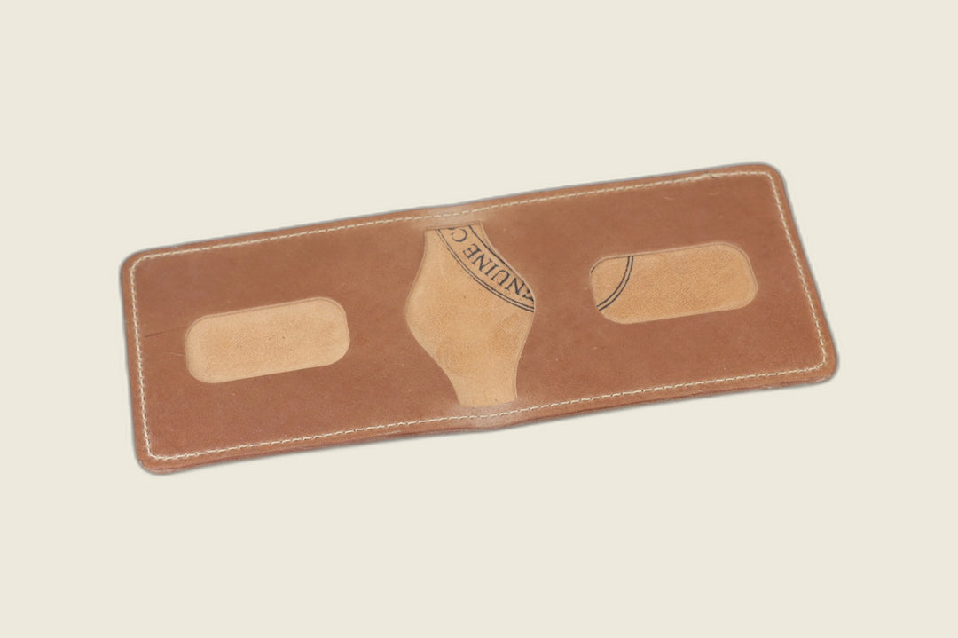Stronghold bifold in natural glazed shell cordovan opened to card recesses with tannery stamp showing