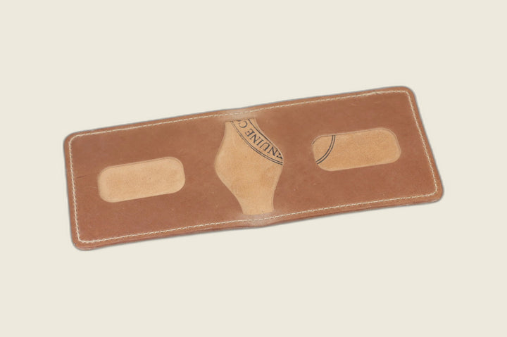 Stronghold bifold in natural glazed shell cordovan opened to card recesses with tannery stamp showing
