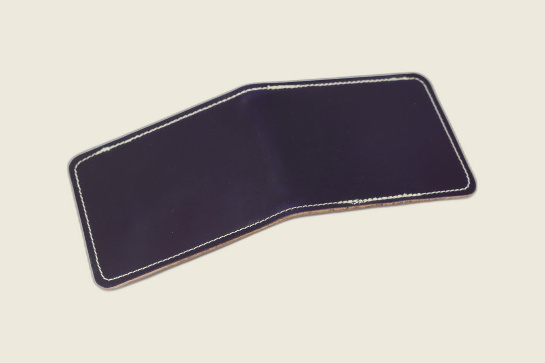 Stronghold bifold wallet in glossy violet Shinki shell cordovan, open flat with cream stitching