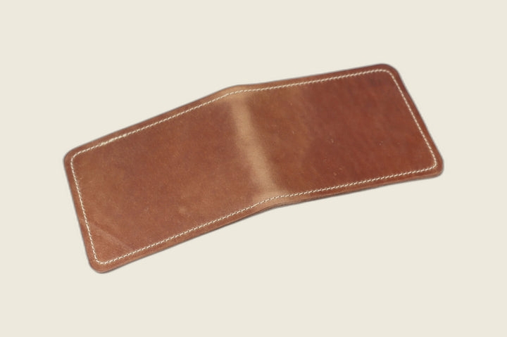 Stronghold bifold wallet in marbled whiskey shell cordovan, open flat showing russet shading