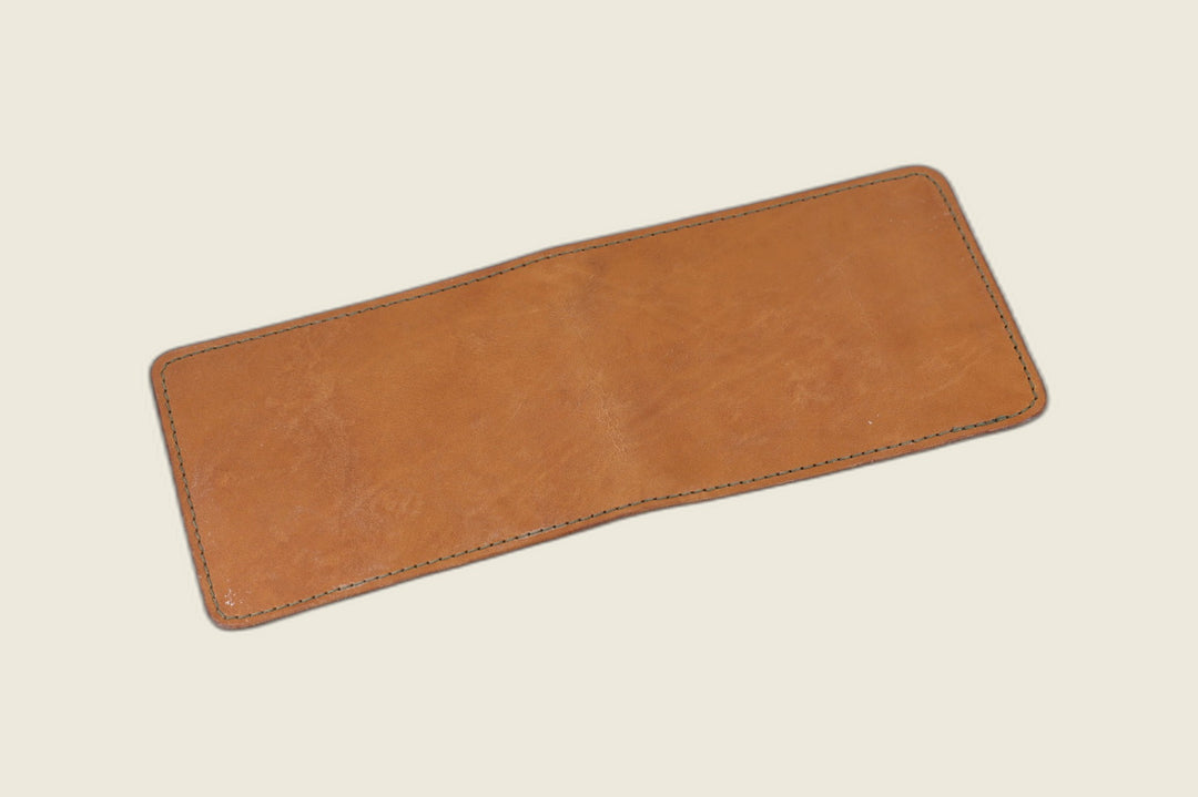 Stronghold bifold wallet in golden tan Horween 1940s calfskin, open flat showing the smooth exterior