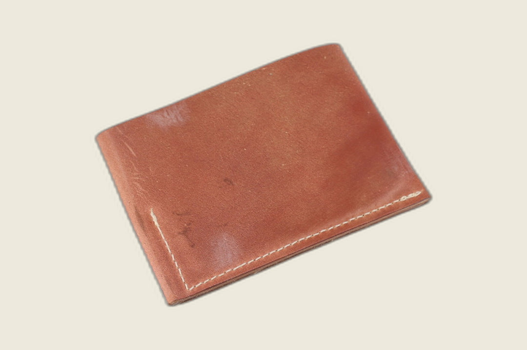 Back of the marbled light brown shell cordovan Sentinel wallet, russet tones with corner stitching