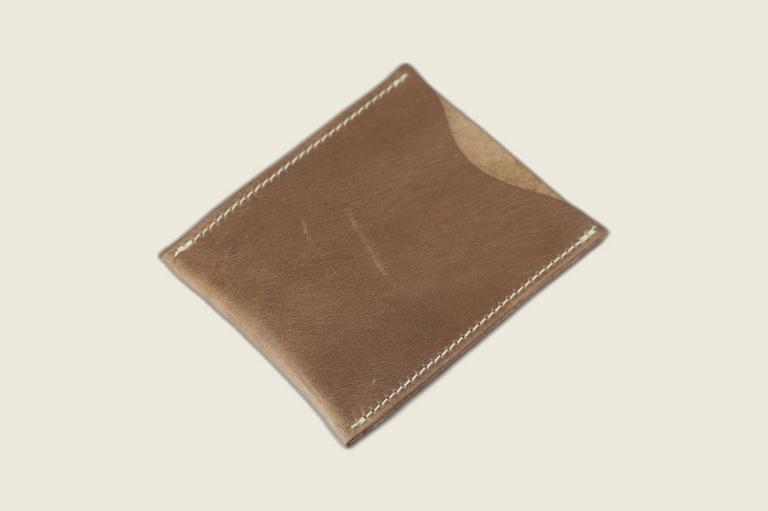 Safeguard sleeve front in natural Chromexcel horsehide, tan pull-up grain with cream stitching and thumb scoop