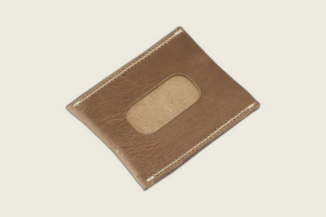 ID window side of the natural Chromexcel horsehide sleeve, rounded cutout over a rough suede backer