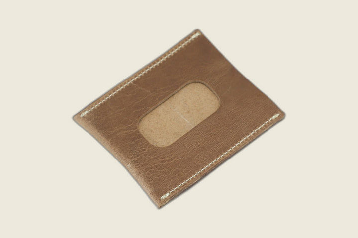 ID window side of the natural Chromexcel horsehide sleeve, rounded cutout over a rough suede backer