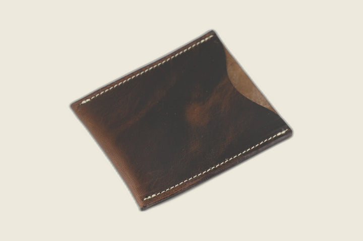 Safeguard sleeve front in Horween natural workshoe butt with rich brown pull-up shine and thumb scoop