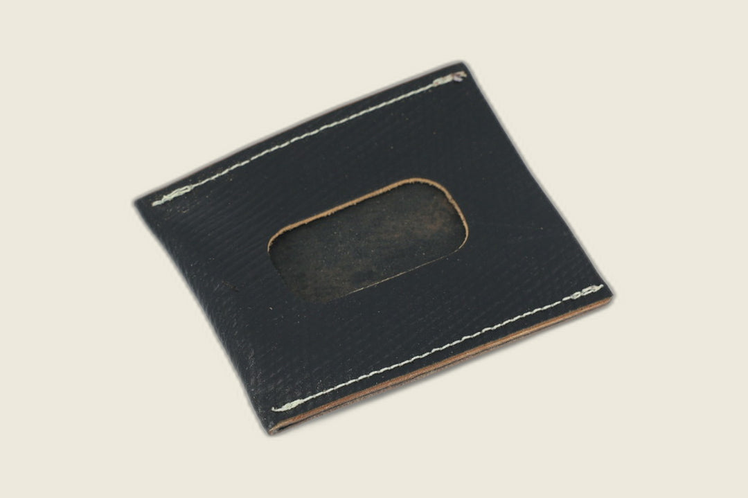 ID window side of the black Russian grain sleeve, rounded cutout over a dark suede backer