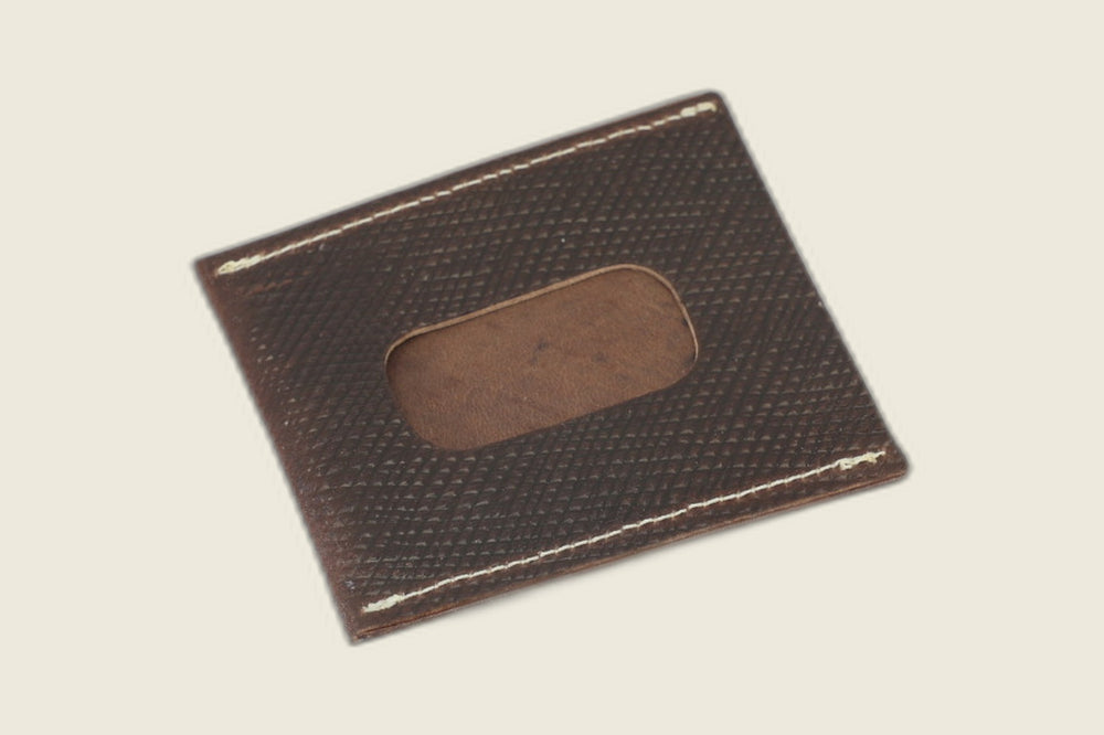 Back of the dark brown Russian grain Safeguard sleeve showing the rounded ID window cutout, angled on cream backdrop
