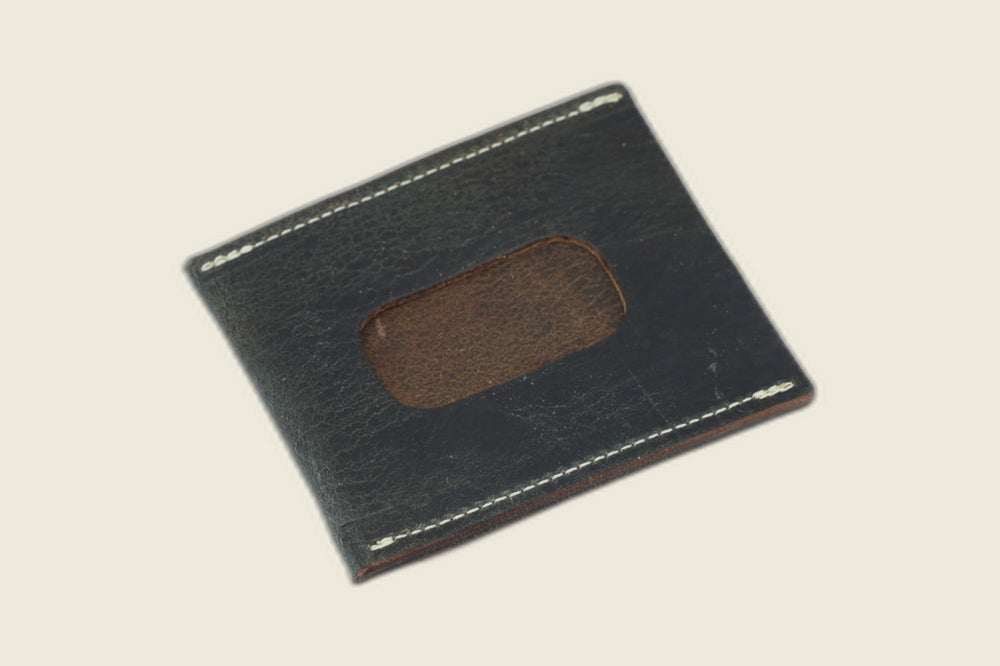 ID window side of the navy workshoe butt Safeguard sleeve, brown suede showing through the rounded cutout