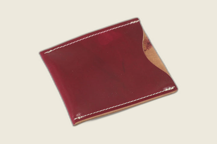 Safeguard sleeve front in glossy ultraviolet Rocado shell cordovan with natural shell peeking at the thumb scoop