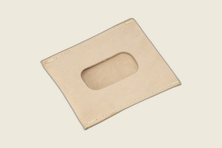 ID window side of the unglazed natural shell cordovan sleeve, rounded cutout showing a sueded natural backer