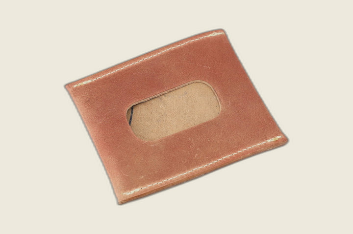 ID window side of the marbled whiskey shell cordovan sleeve, tan suede showing through the cutout