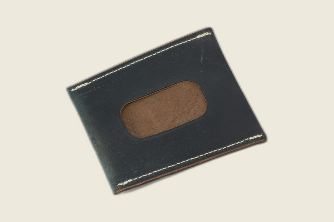 ID window side of the navy workshoe butt card sleeve, brown suede filling the rounded cutout