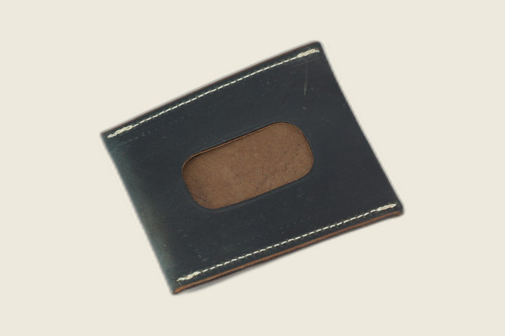 ID window side of the navy workshoe butt card sleeve, brown suede filling the rounded cutout
