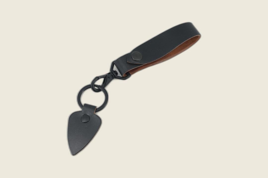 Lanyard in black Horween workshoe butt with black snap, swivel clasp, key ring and arrowhead leather fob