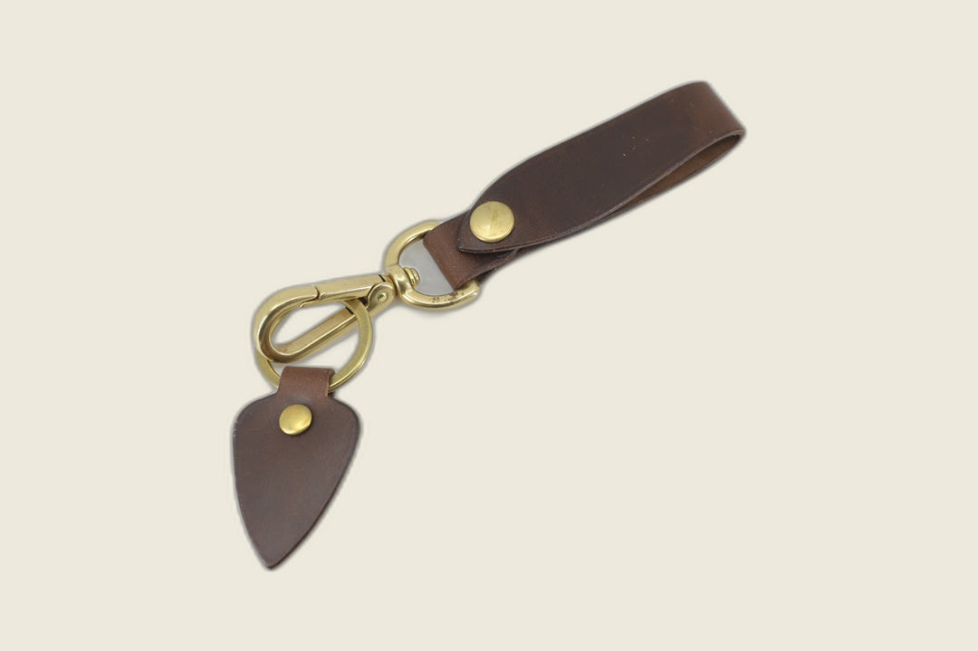 Lanyard in natural Horween workshoe butt with brass snap, swivel clasp, key ring and arrowhead leather fob