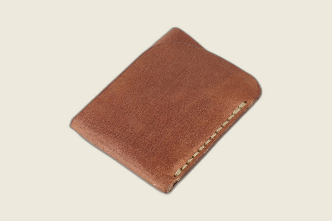 Vanguard minimal card sleeve in Hermann Oak natural Old World harness leather with cream stitching, front view
